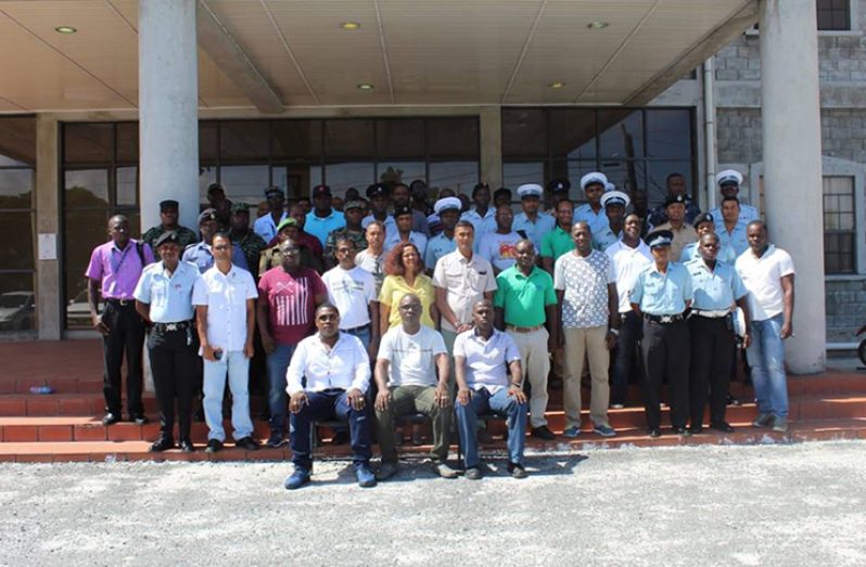 (Centre seated) Traffic Chief, Superintendent Linden Isles, flanked by Deputy Superintendent Dennis Stephens, Traffic Education Officer, Inspector Raun Clarke and participants of the driving seminar