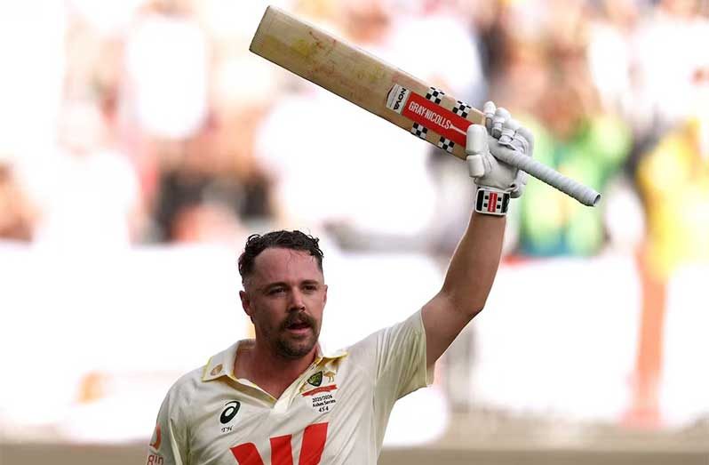 Australia’s Travis Head raises his bat as he walks after losing his wicket, caught by England’s Ollie Pope off the bowling of Brydon Carse (REUTERS/Asanka Brendon Ratnayake)