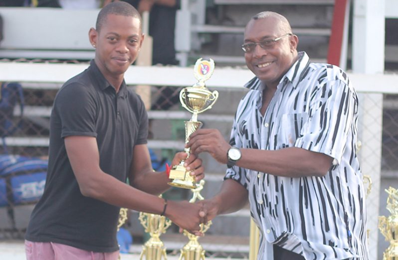 Trevon France collects his award from GCA executive member and former DCC national cricketer Mark Harper.