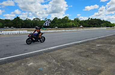 Matthew Vieira waves a chequered flag, his second of the weekend