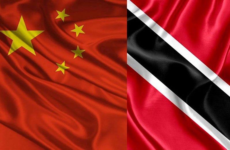 Side by side: The national flags of the People's Republic of China and the Republic of Trinidad and Tobago