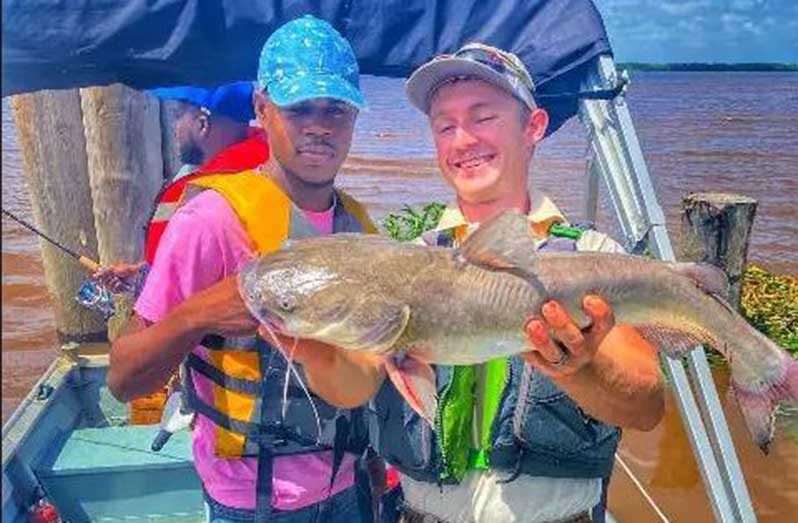 Dillon Ross with a client on a fishing trip