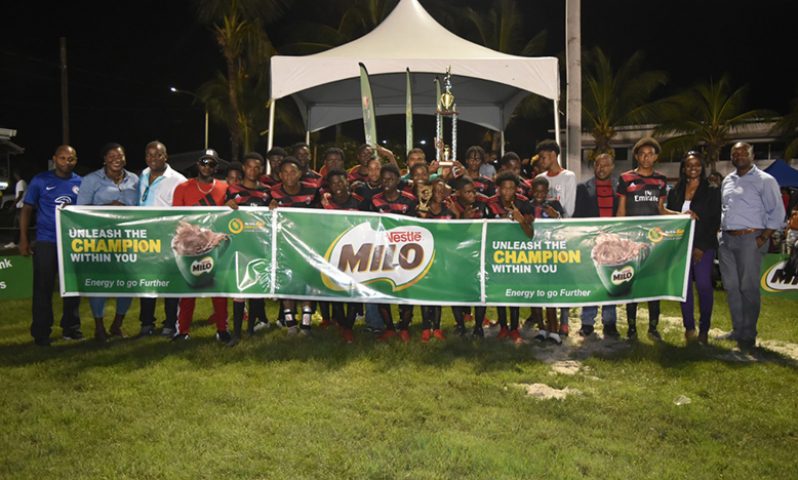 Christianburg /Wismar Secondary pose with their MILO schools football trophy