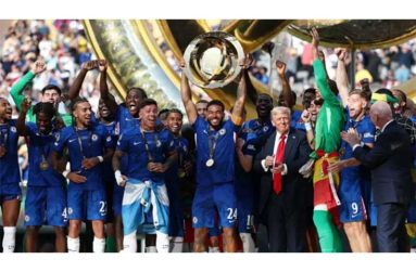 The winning Chelsea players celebrate with the trophy and US President Donald Trump