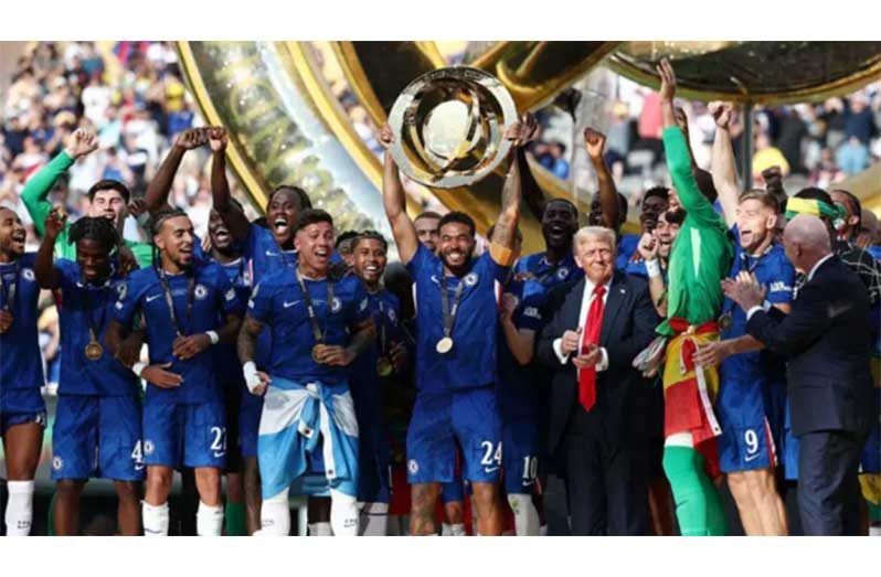 The winning Chelsea players celebrate with the trophy and US President Donald Trump