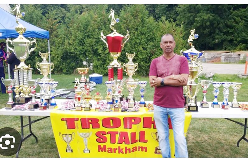 Trophy Stall’s owner Ramesh Sunich proudly displays the trophies and medals up for grabs for the tournament