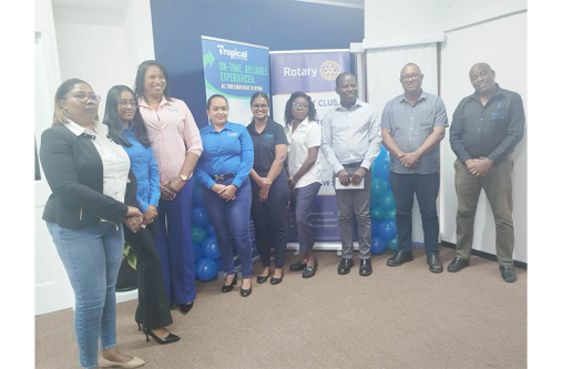 Tropical Shipping Guyana’s Country Manager, Glenis Hodge (third from left), with her team, and President of the Rotary Club of Georgetown Central, Lloyd David (third from right)