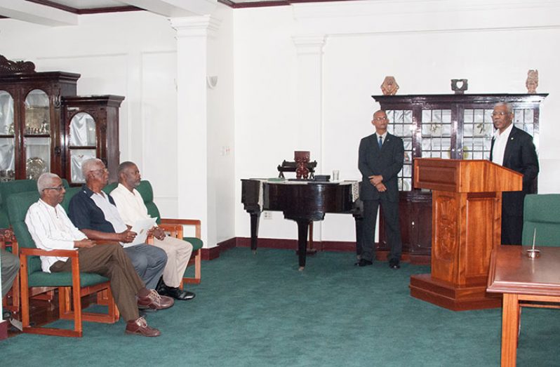President David Granger speaks during the swearing in of Desmond Trotman as GECOM Commissioner. Also seated in photo are GECOM Chair, Justice (ret’d) James Patterson (left), Desmond Trotman (centre) and Commissioner Charles Corbin (right); Standing is Director of Protocol, Colonel Francis Abraham (Delano Williams)