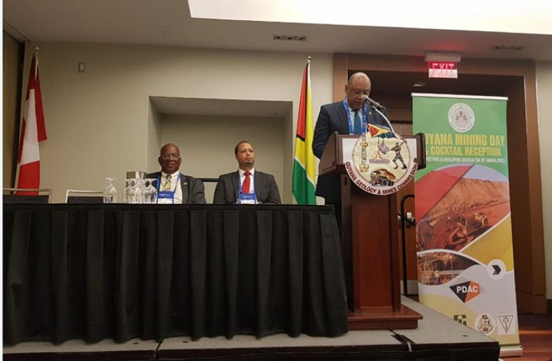 Natural Resources Minister Raphael Trotman speaking at the Guyana Day event in Canada. At extreme left is Finance Minister Winston Jordan.