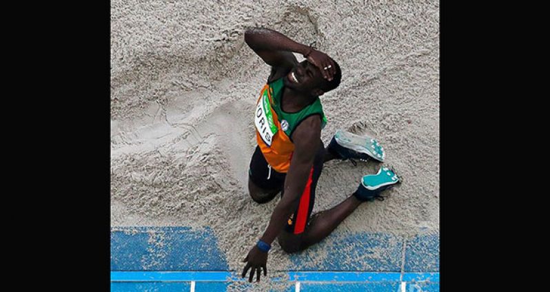 Guyana's Troy Doris reacts to a jump in the triple jump final yesterday.