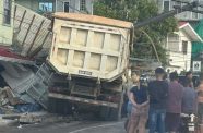 This truck collided with a utility pole and multiple stationary vehicles along Sheriff Street before crashing into a nearby building