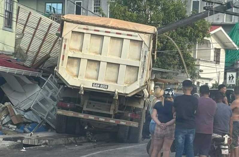 This truck collided with a utility pole and multiple stationary vehicles along Sheriff Street before crashing into a nearby building