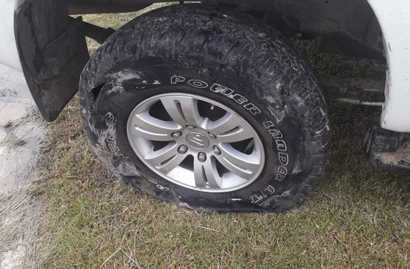 The slashed tyre on the police  vehicle