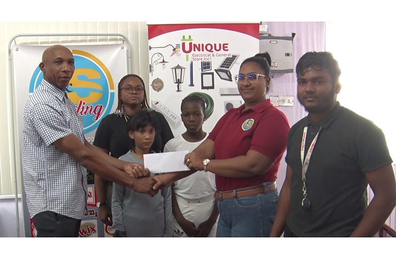 GCA Competitions Chairman Shaun Massiah collecting the sponsorship from I&S Trading on Thursday