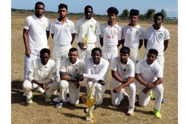 The New Amsterdam Technical Institute (NATI) team with the championship trophy.