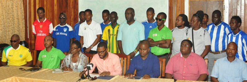 President of the UDFA, Sharma Solomon, flanked by his executives and affiliated club captains at yesterday’s press conference.