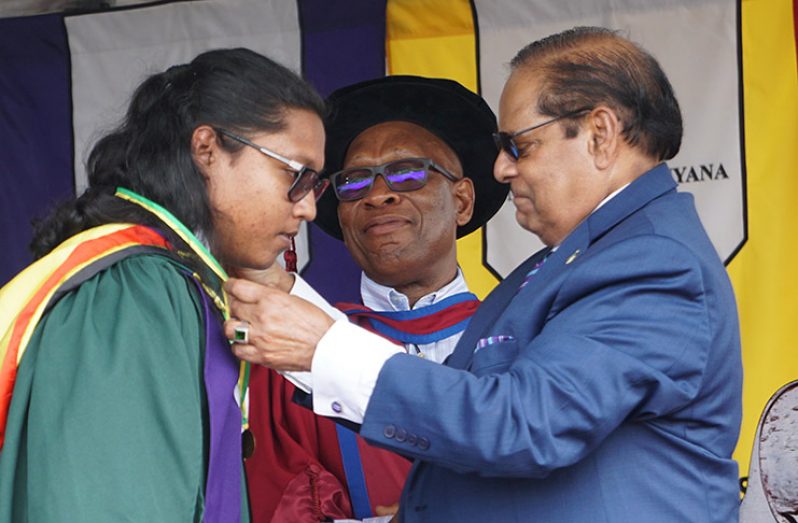 One of the two valedictorians, Shane Rampertab, receives the President’s Medal from Prime Minister Moses Nagamootoo (Carl Croker photo)