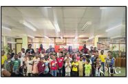 Third from left: Courts Optical Chain Manager, Mr. Richard Simpson; UG Vice-Chancellor, Professor Paloma Mohamed Martin; Managing Director of Unicomer Guyana, Ms. Gillian Matthews; UG’s Chief Librarian, Ms. Debra Lowe; along with other staff of the University of Guyana and Unicomer, and children participating in this year’s Reading is Fun programme