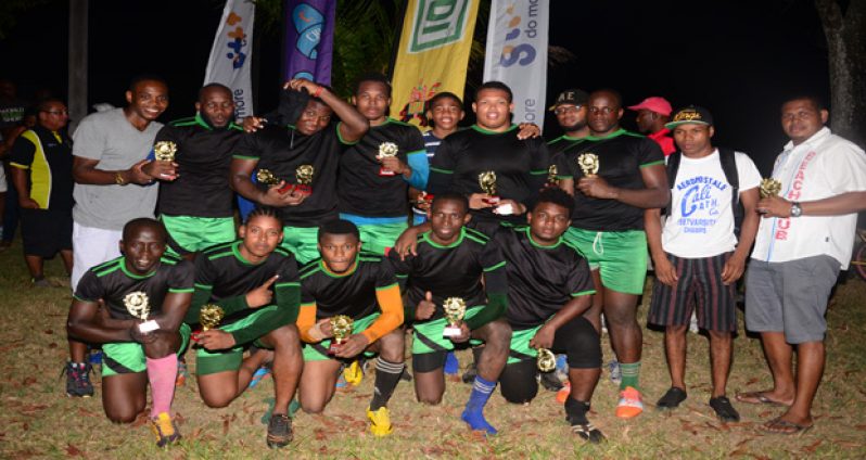 The victorious University of Guyana team show off their prizes. (Adrian Narine photo)