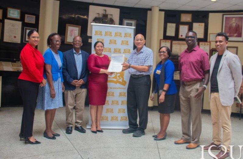 (From left to right) Research and Development Officer & Coordinator, Associate for Arts General Studies Programme, Office of the Deputy Vice-Chancellor, Academic Engagement, Ms Suzette James; Dean of the Faculty of Engineering and Technology (FET), Ms Verlyn Klass; Deputy Vice-Chancellor for Academic Engagement, Professor Emanuel Cummings; University of Guyana Vice-Chancellor, Professor Paloma Mohamed- Martin; Human Resources Director, Banks DIH Limited, Mr Andrew Carto; Human Resources Executive Mrs Sharon Nelson; and Operations Director, Banks DIH Limited, Mr Gavin Todd; and Industrial Liason Officer (FET), Mr Anil James