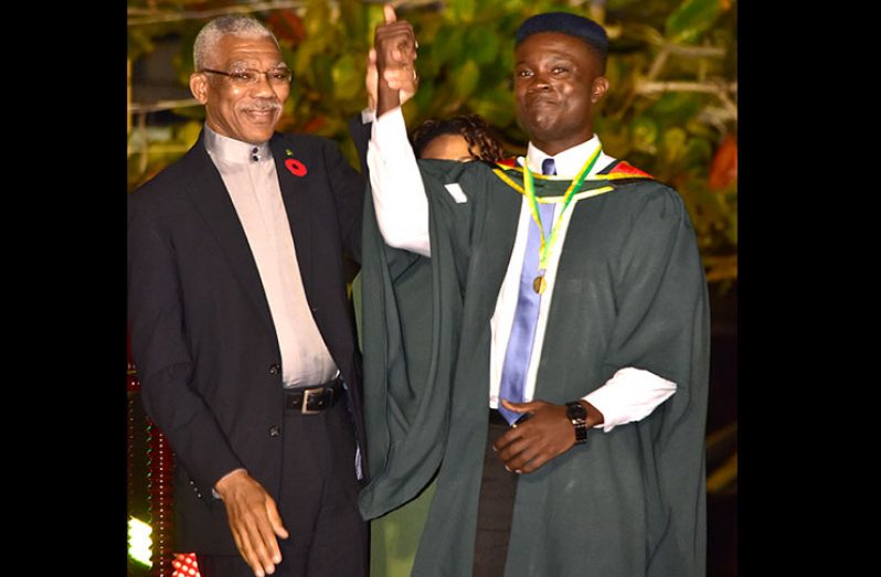 President Granger and 2016 Valedictorian Dr Kidwey Peterkin