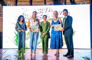 First Lady Arya Ali flanked by British High Commissioner to Guyana, Jane Miller who receives a copy of the audiobook from managing director of EMC, Shyam Nokta and other local collaborators