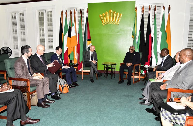 President David Granger (right) in discussion with UN representative in the Guyana – Venezuela border controversy, Ambassador Dag Halvor Nylander during a meeting at State House, as other officials look on