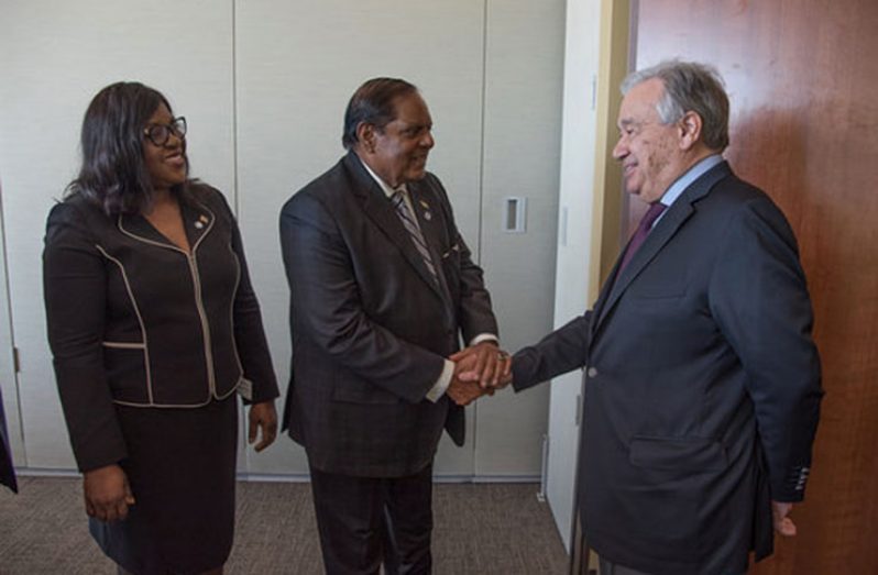 Antonio Guterres greeting Prime Minister, Moses Nagamootoo, as Minister of Foreign Affairs, Dr. Karen Cummings, looks on