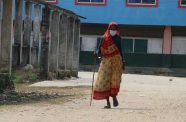 Older women, in particular, face additional challenges and prejudice due to ageist attitudes and discrimination. Pictured here, a 69-year-old woman walks in a village in Nepal (UNICEF/Preena Shrestha)