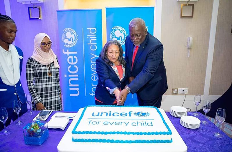 Prime Minister Brigadier (Ret’d) Mark Phillips and UNICEF Regional Director for Latin America and the Caribbean Jean Gough partake in a ceremonial cake-cutting exercise to commemorate the launch of UNICEF’s five-year work programme