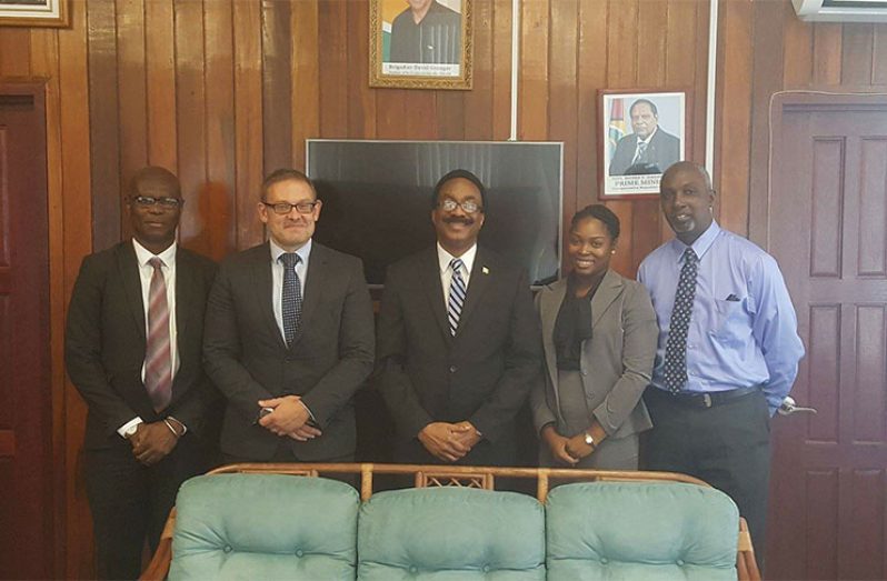 Attorney General, Basil Williams flanked by, (from l-r) Sydney James, Head of SOCU; David Robinson, Anti-Corruption Adviser for (UNODC); Matthew Langevine, Director of the FIU and Ms. Joann Bond, Senior Parliamentary Counsel.