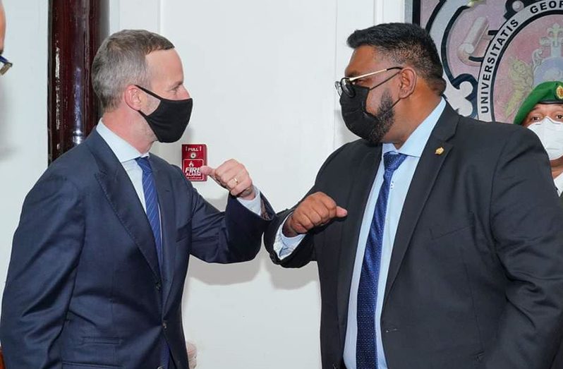 Chief Executive Officer of the U.S. International Development Finance Corporation, Adam Boehler greets President Irfaan Ali at State House during a reception held in his honour (Office of the President photo)