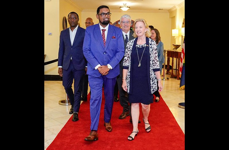 President, Dr. Irfaan Ali and United States Ambassador to Guyana, Sarah-Ann Lynch, along with Minister of Foreign Affairs and International Co-operation, Hugh Todd, make their way into the Independence celebration activities, on Thursday evening (Latchman Singh photo)