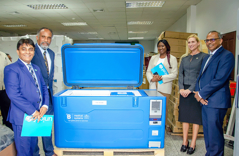 US Ambassador, Nicole D. Theriot; USAID-ESC Regional Representative, Mervyn Farroe; Minister of Health, Dr. Frank Anthony and UNICEF Deputy Representative, Irfan Akhtar with a solar refrigerator