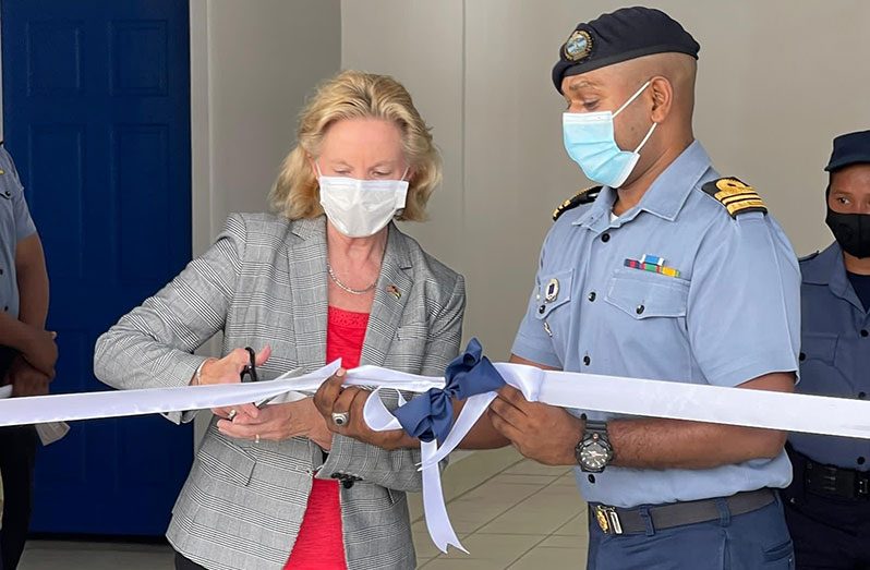 U.S. Ambassador Sarah-Ann Lynch cuts the ceremonial ribbon at Thursday’s commissioning ceremony at the  Coast Guard Training Centre in Kingston