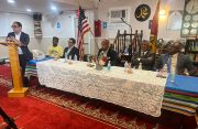 Deputy Ambassador of Guyana to the United States of America, Zulfikar Aly addresses persons at Al Abidin Masjid on Liberty Avenue and 127th Street in Richmond Hill, while Guyana’s Ambassador to the US, Samuel Hinds (second right), and other officials look on