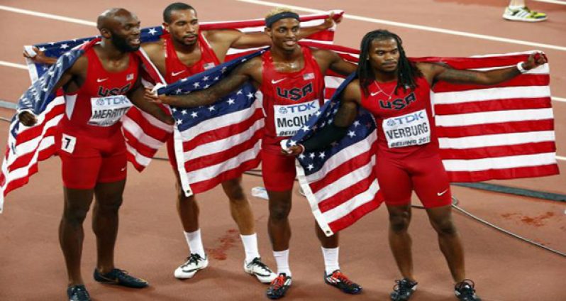 (L-R) LaShawn Merritt of the U.S. poses with teammates Bryshon Nellum, Tony McQuay and David Verburg after winning the men's 4x400 metres relay final at the 15th IAAF Championships during the 15th IAAF World Championships at the National Stadium in Beijing, China. (Reuters/David Gray)