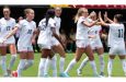 Izzy Engle (third right) of the USA celebrates after scoring one of her four goals against Guyana.