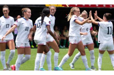 Izzy Engle (third right) of the USA celebrates after scoring one of her four goals against Guyana.
