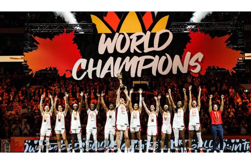 The USA women’s players celebrate their victory