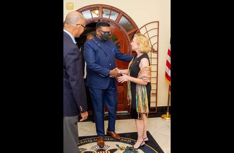 US Ambassador to Guyana, Sarah-Ann Lynch, greets President, Dr. Irfaan Ali, (Office of the President photo)