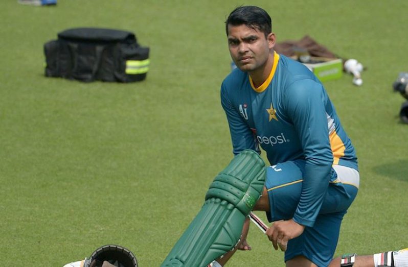 Umar Akmal pads up (AFP)