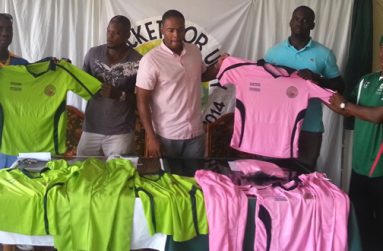 From left; Clive Grimmond, Dexter ‘Bushman’ Garnett, Carey Griffith, Quason Nedd and Coordinator Uzzi Yisrael proudly display the two uniforms that will be used by the two teams, at the Windjammer Hotel yesterday.