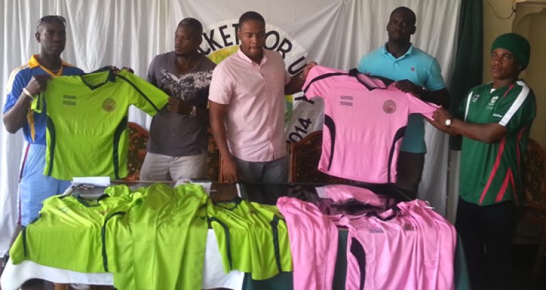 From left; Clive Grimmond, Dexter ‘Bushman’ Garnett, Carey Griffith, Quason Nedd and Coordinator Uzzi Yisrael proudly display the two uniforms that will be used by the two teams, at the Windjammer Hotel yesterday.
