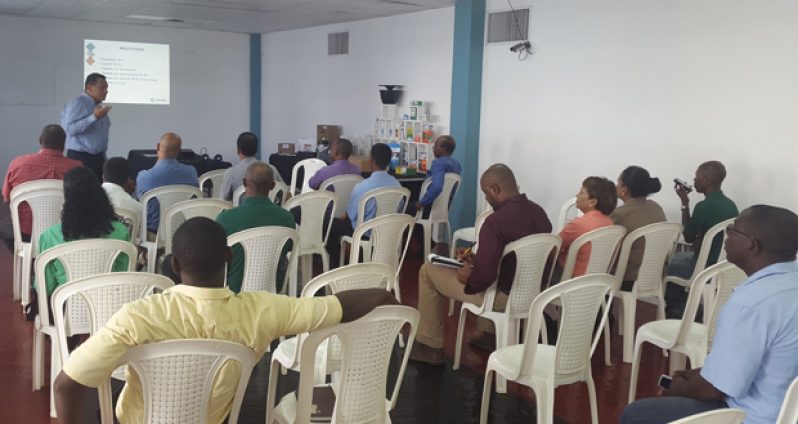 Univar Divisional Account Executive, Raoul Persaud (standing), discusses the importance and benefit of the ‘In2Care Mosquito Trap’ with pest control officers at the Giftland Mall yesterday