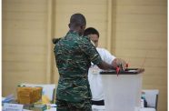 A file photo of a GDF rank casting his ballot