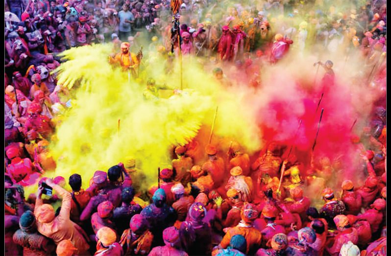 “A scene from Phagwah among a large crowd”