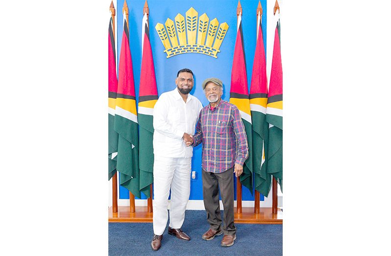 On Wednesday, President Dr. Irfaan Ali received a visit from the acclaimed British-Guyanese actor and musician, Ram John Holder. He is best known for his iconic role as Augustus Neapolitan Cleveland "Porkpie" Grant in the beloved British sitcom *Desmond's*, which aired from 1989 to 1994. The show beautifully captured the vibrant lives of Caribbean immigrants in London. During the interaction, President Ali Congratulated Holder, now 91 years old, for his outstanding contributions to the global arts. He is a shining example of Guyanese talent and pride at home and across the diaspora (Photo: President Ali/Facebook)