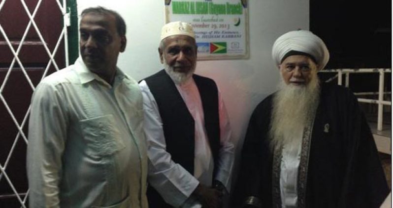 Renowned Muslim scholar Shaikh Hisham, Maulana Waffee, the Imam Raffik representative of Trinidad and the President General of ACIC, Hakeem Khan, unveiling the plaque.