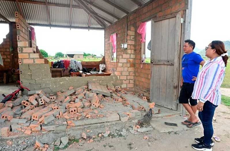 Minister of Amerindian Affairs Pauline Sukhai engaging one of the residents who were affected by the recent storm